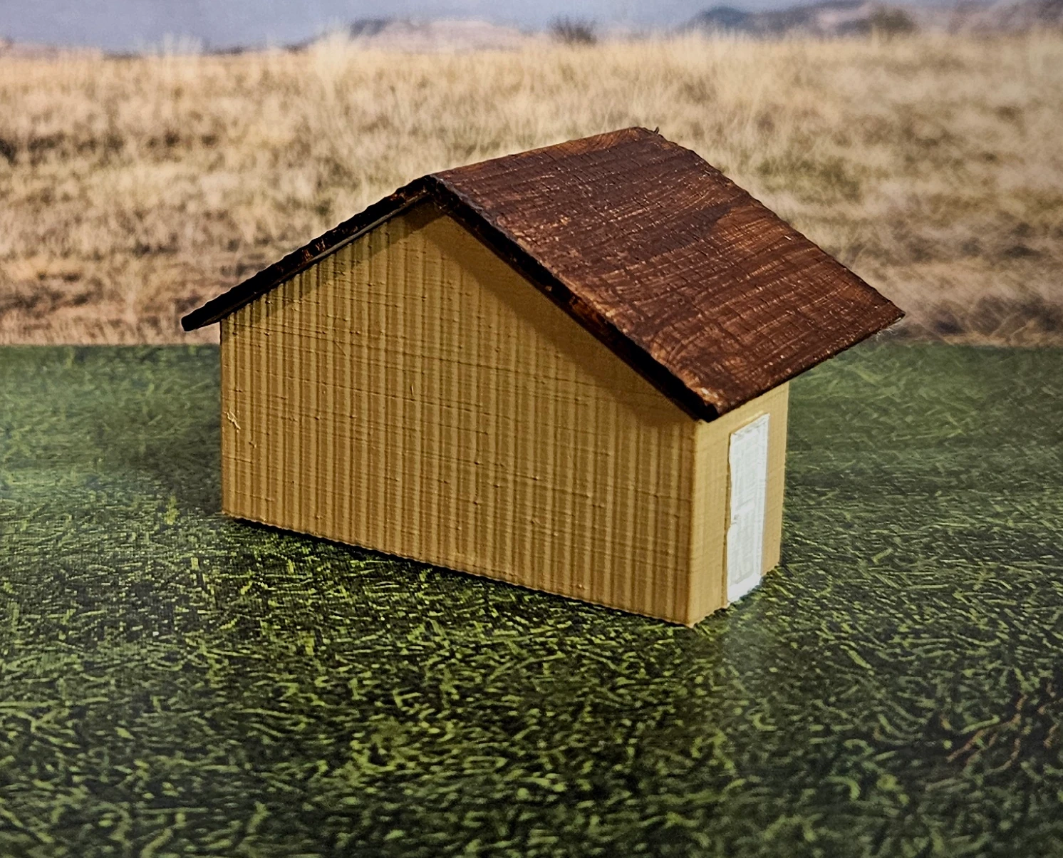 Close-up of N scale large building and waterwheel